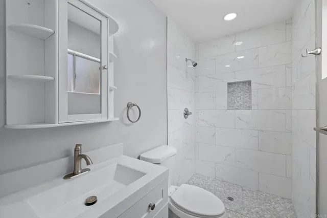 a view of an empty room and wooden floor