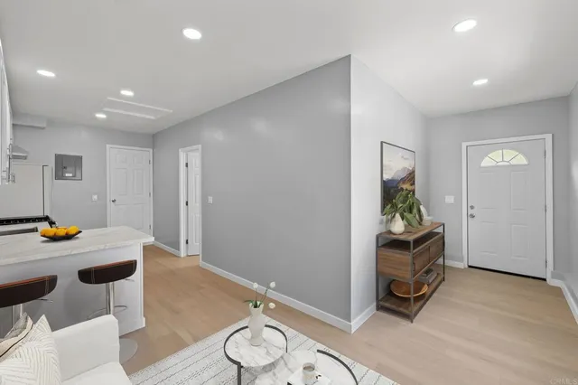 a view of kitchen with furniture and refrigerator