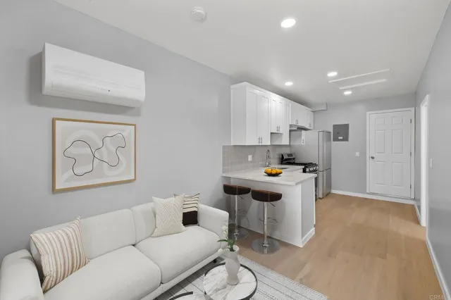 a kitchen with cabinets appliances and a sink