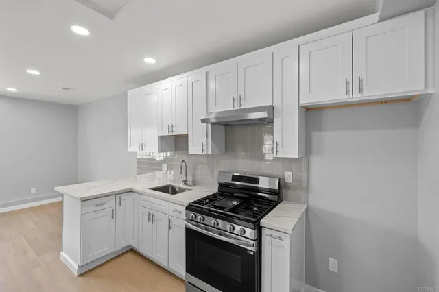 a bedroom with a bed and the wall painting