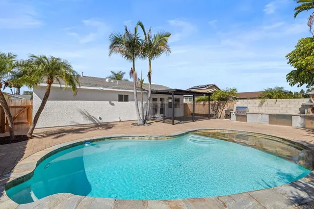 a view of a swimming pool with a patio