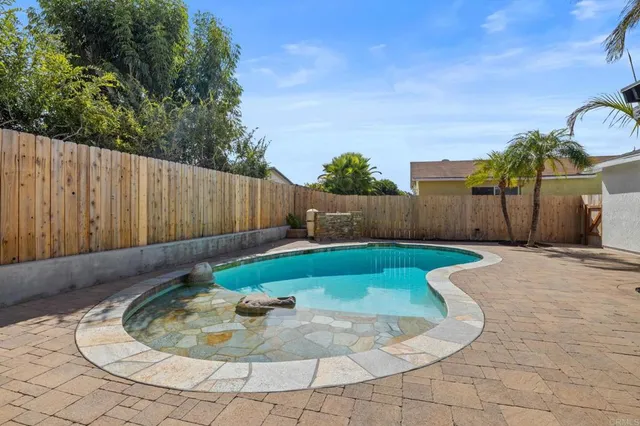 a view of backyard with green space