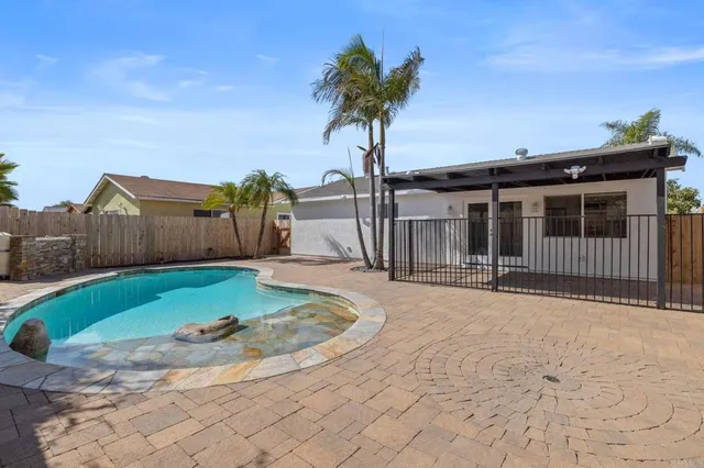 a balcony with furniture and a potted plant