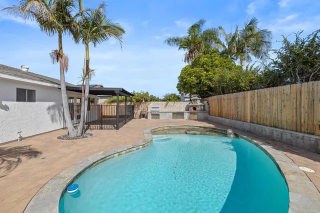 a view of a porch with wooden floor and fence