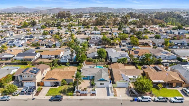an aerial view of a house with a swimming pool