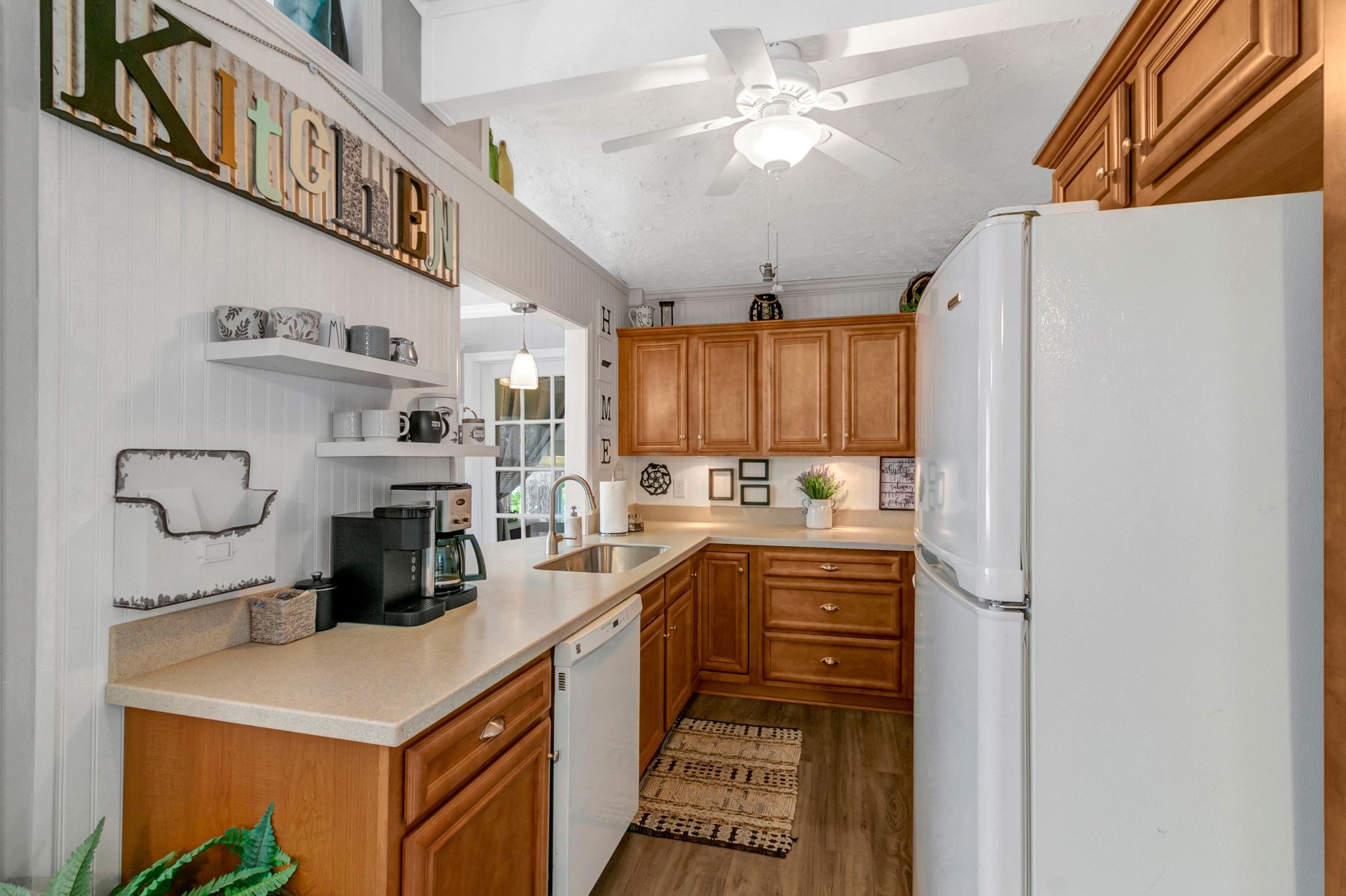 439 Bluff Road Big Sandy, TN 38221 - Photo 17 of 86 a kitchen with kitchen island a sink appliances and cabinets