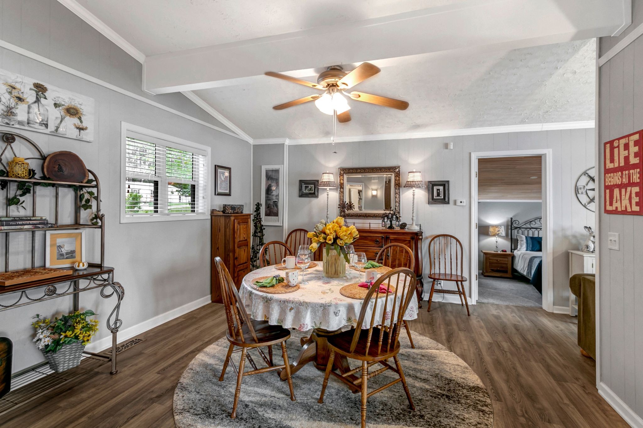 439 Bluff Road Big Sandy, TN 38221 - Photo 19 of 86 a view of a dining room with furniture and wooden floor