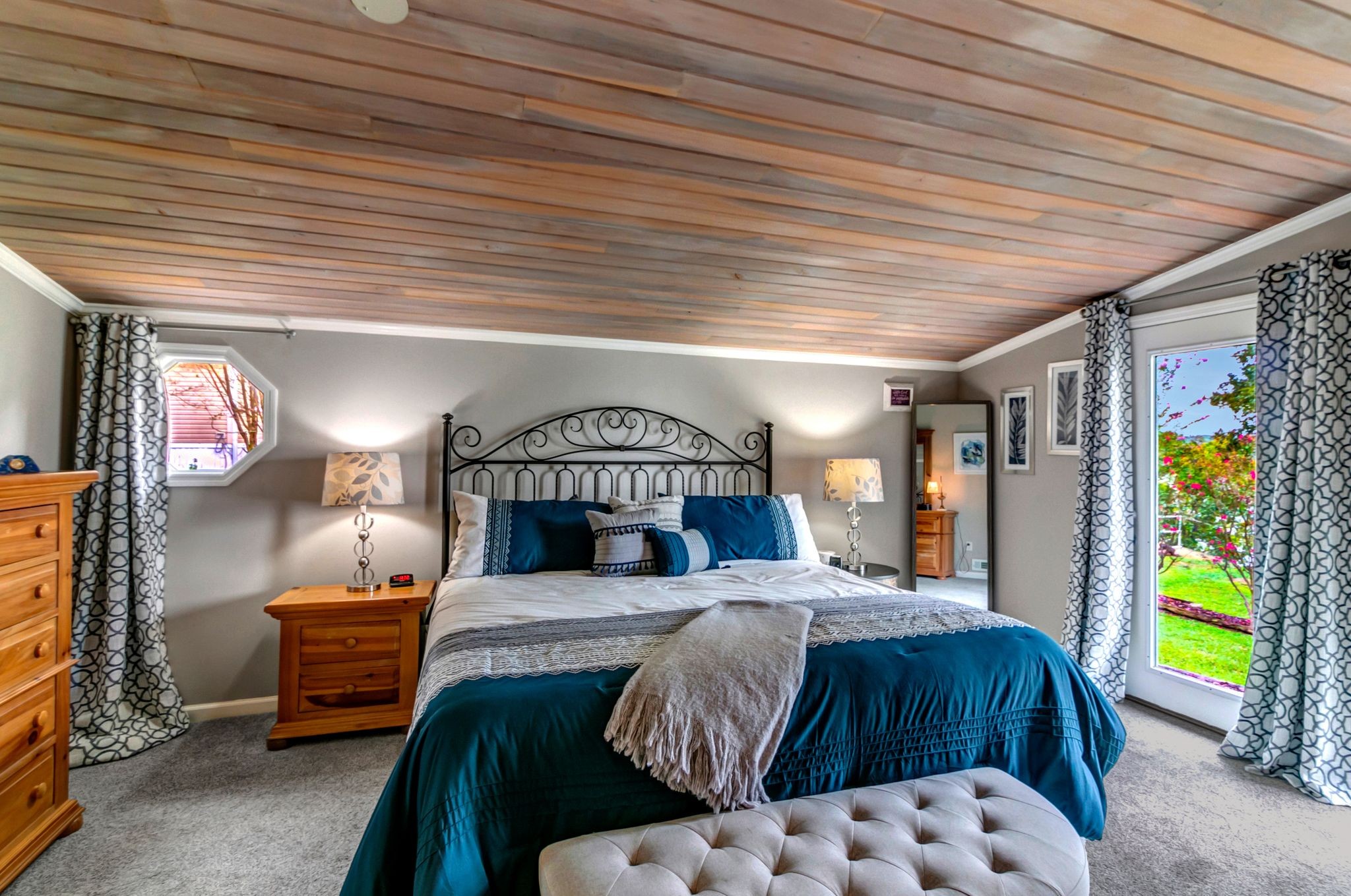 439 Bluff Road Big Sandy, TN 38221 - Photo 21 of 86 a bedroom with a bed and a dresser next to a window