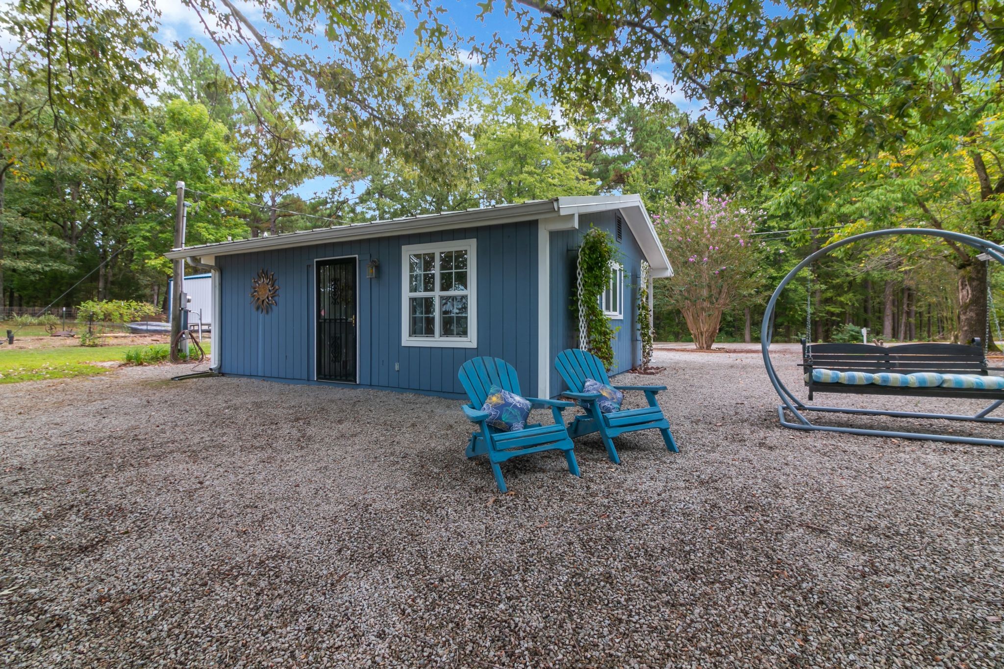439 Bluff Road Big Sandy, TN 38221 - Photo 32 of 86 a view of a house with backyard and chairs
