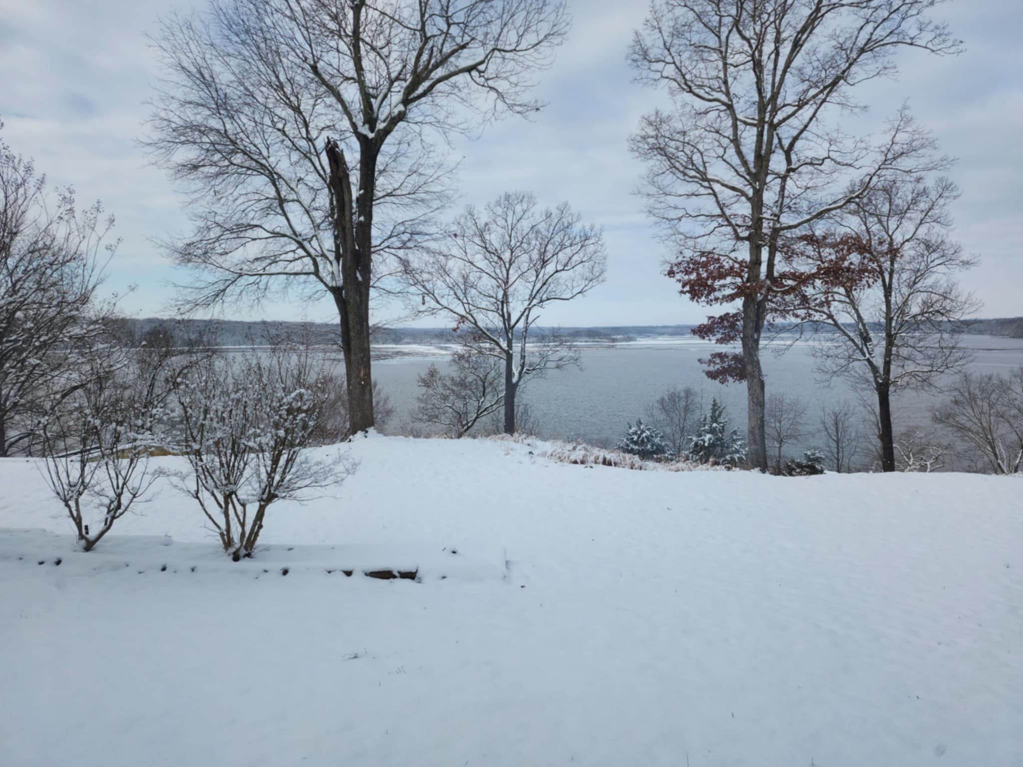 439 Bluff Road Big Sandy, TN 38221 - Photo 47 of 86 a street view covered with snow