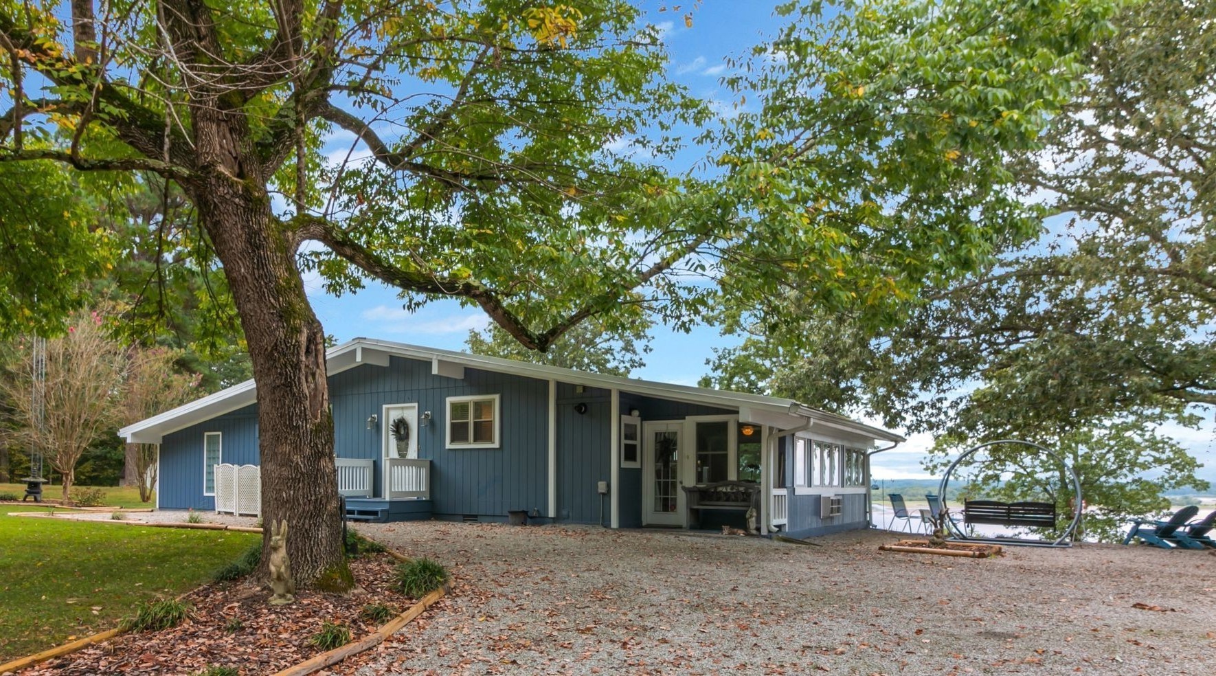 439 Bluff Road Big Sandy, TN 38221 - Photo 5 of 86 a front view of a house with a garden