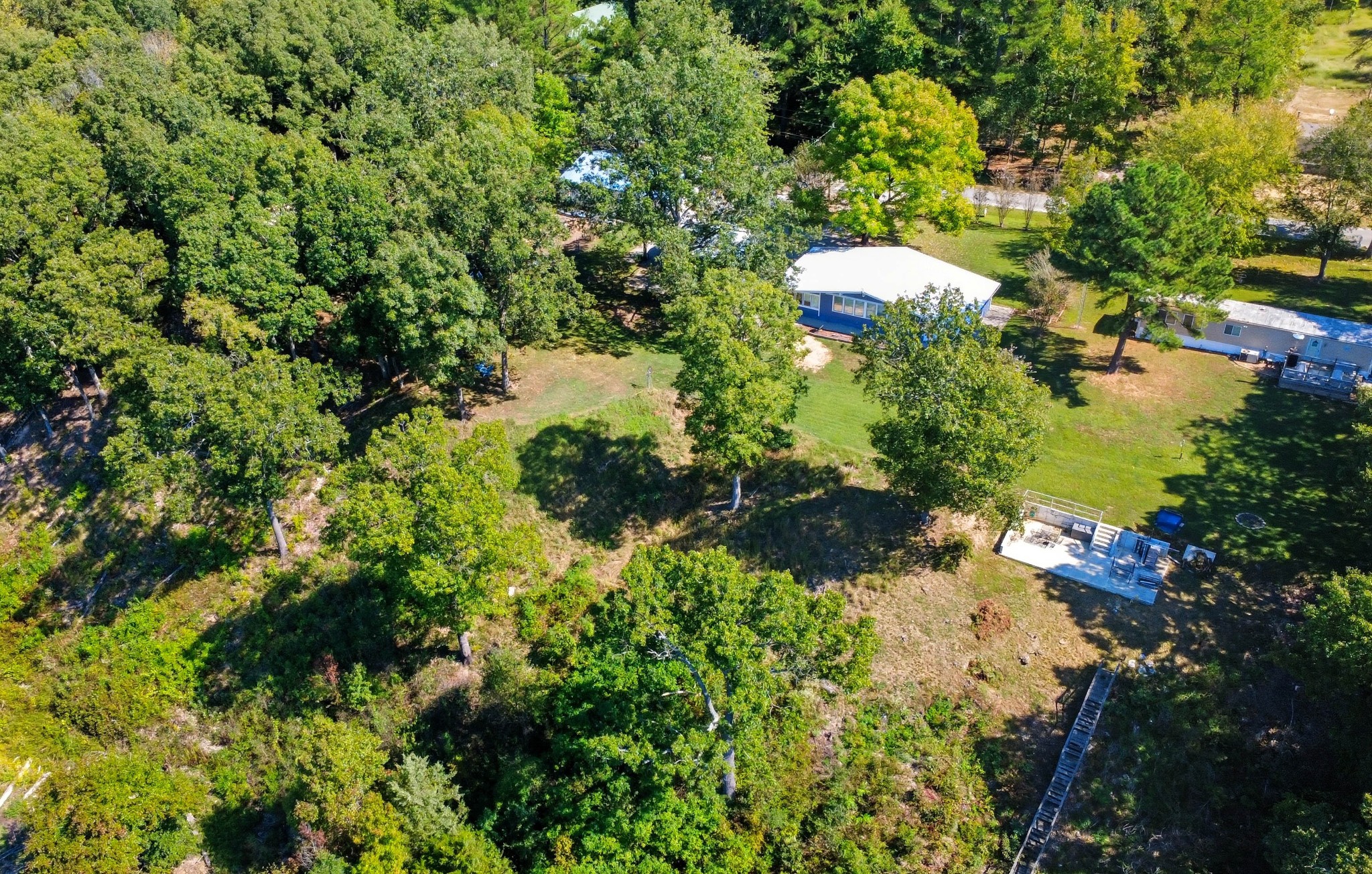 439 Bluff Road Big Sandy, TN 38221 - Photo 63 of 86 a backyard of a house with a yard and outdoor seating