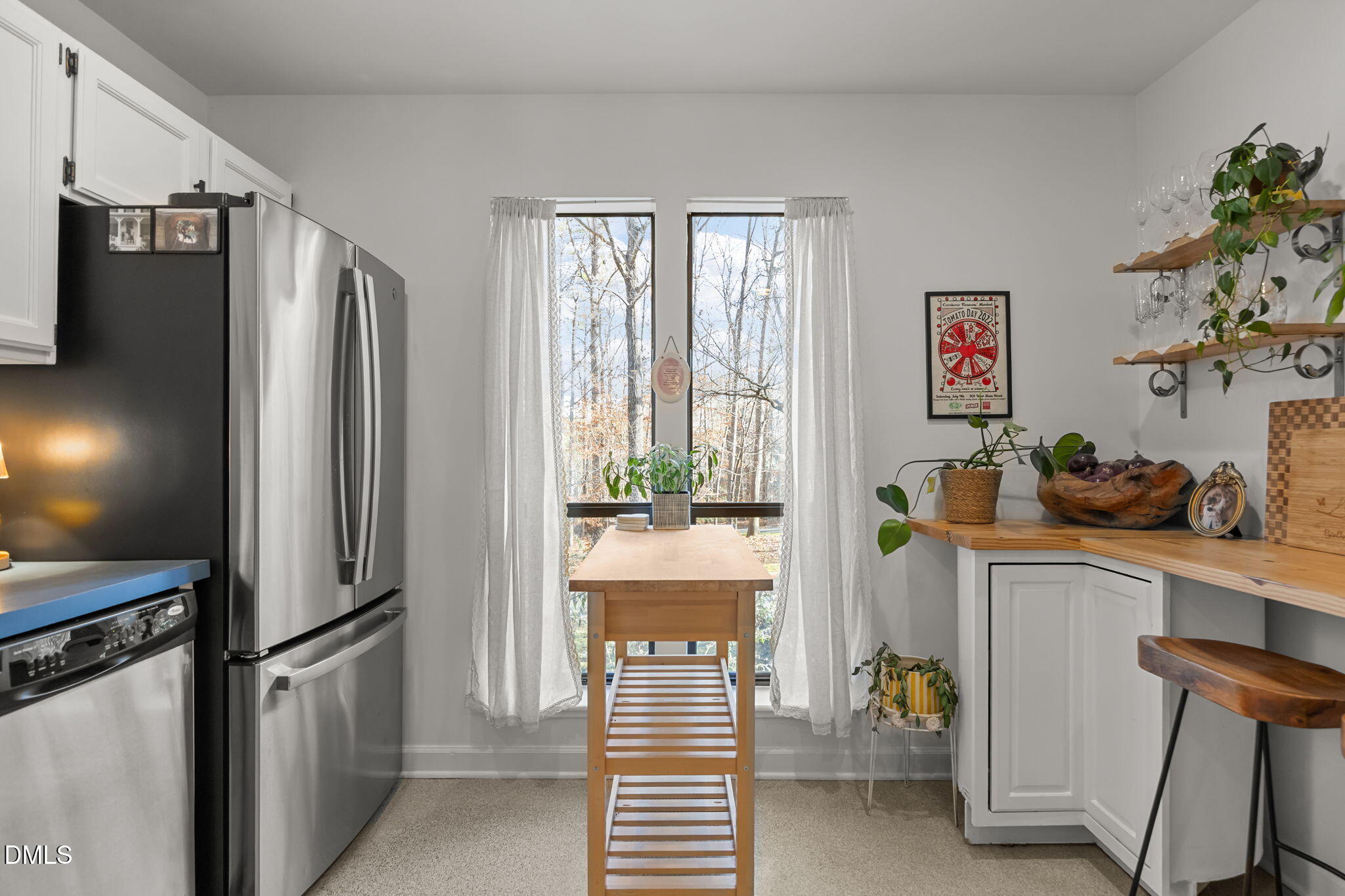 504 Waterside Drive Carrboro, NC 27510 - Photo 11 of 48 a kitchen with stainless steel appliances a refrigerator and a stove