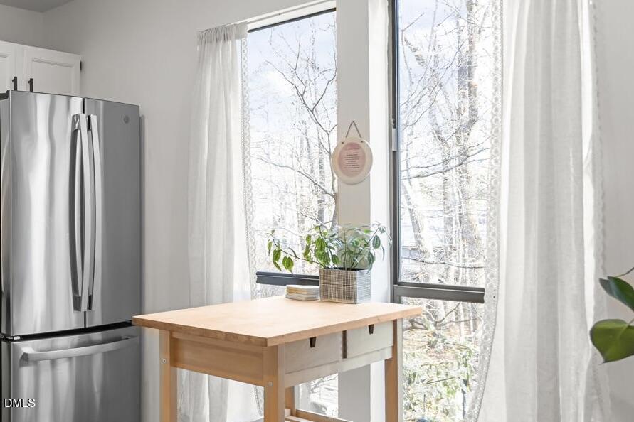 504 Waterside Drive Carrboro, NC 27510 - Photo 12 of 48 a kitchen with a refrigerator and a window