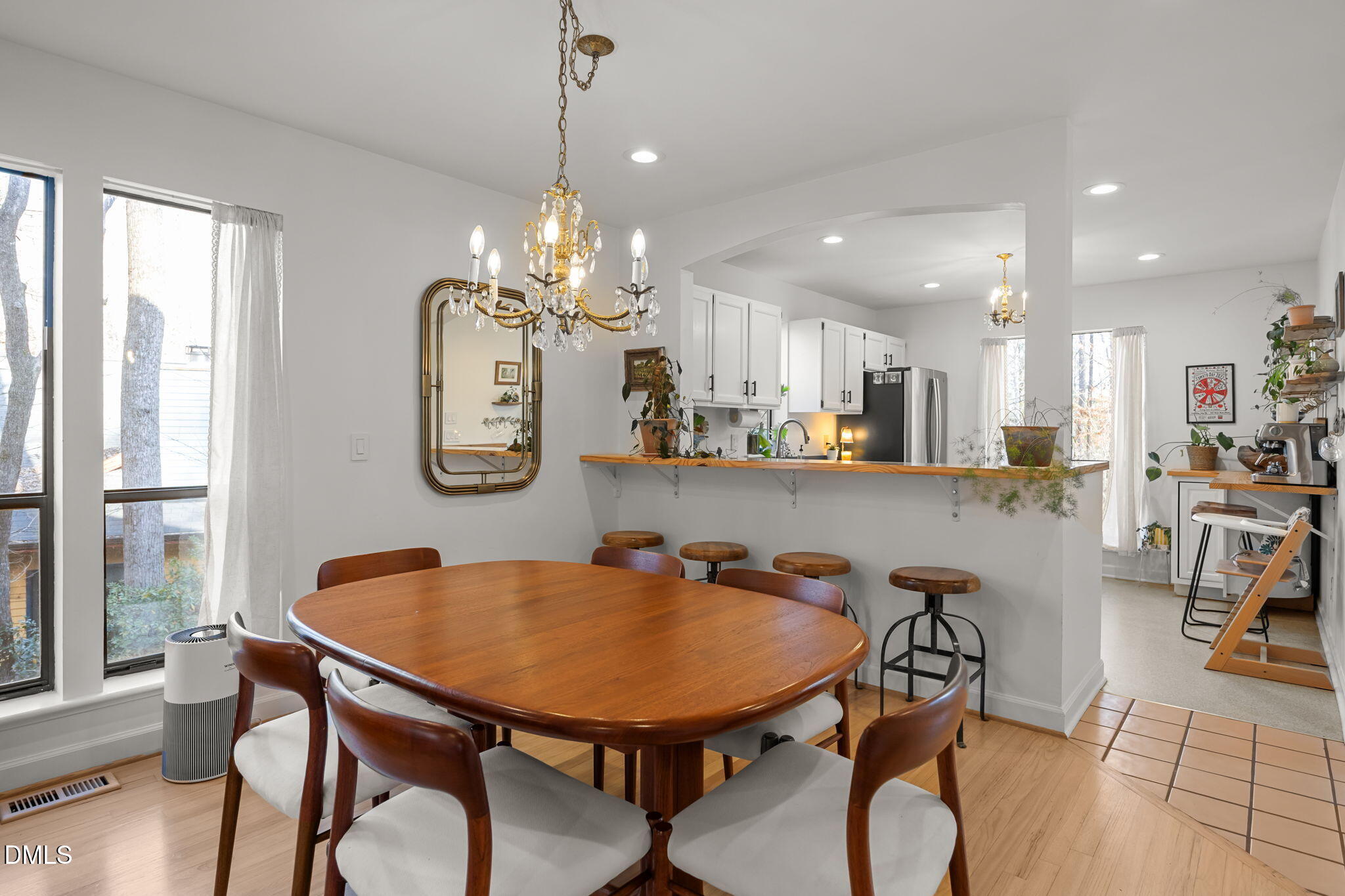 504 Waterside Drive Carrboro, NC 27510 - Photo 17 of 48 a dining room filled chandelier and wooden floor