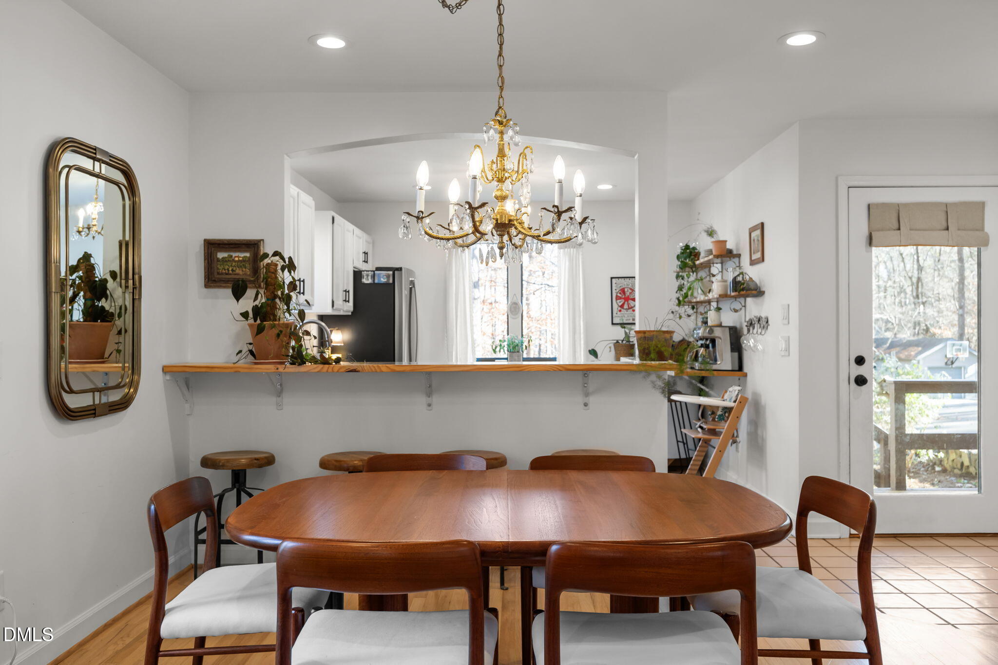 504 Waterside Drive Carrboro, NC 27510 - Photo 20 of 48 a view of a dining room with furniture window and wooden floor