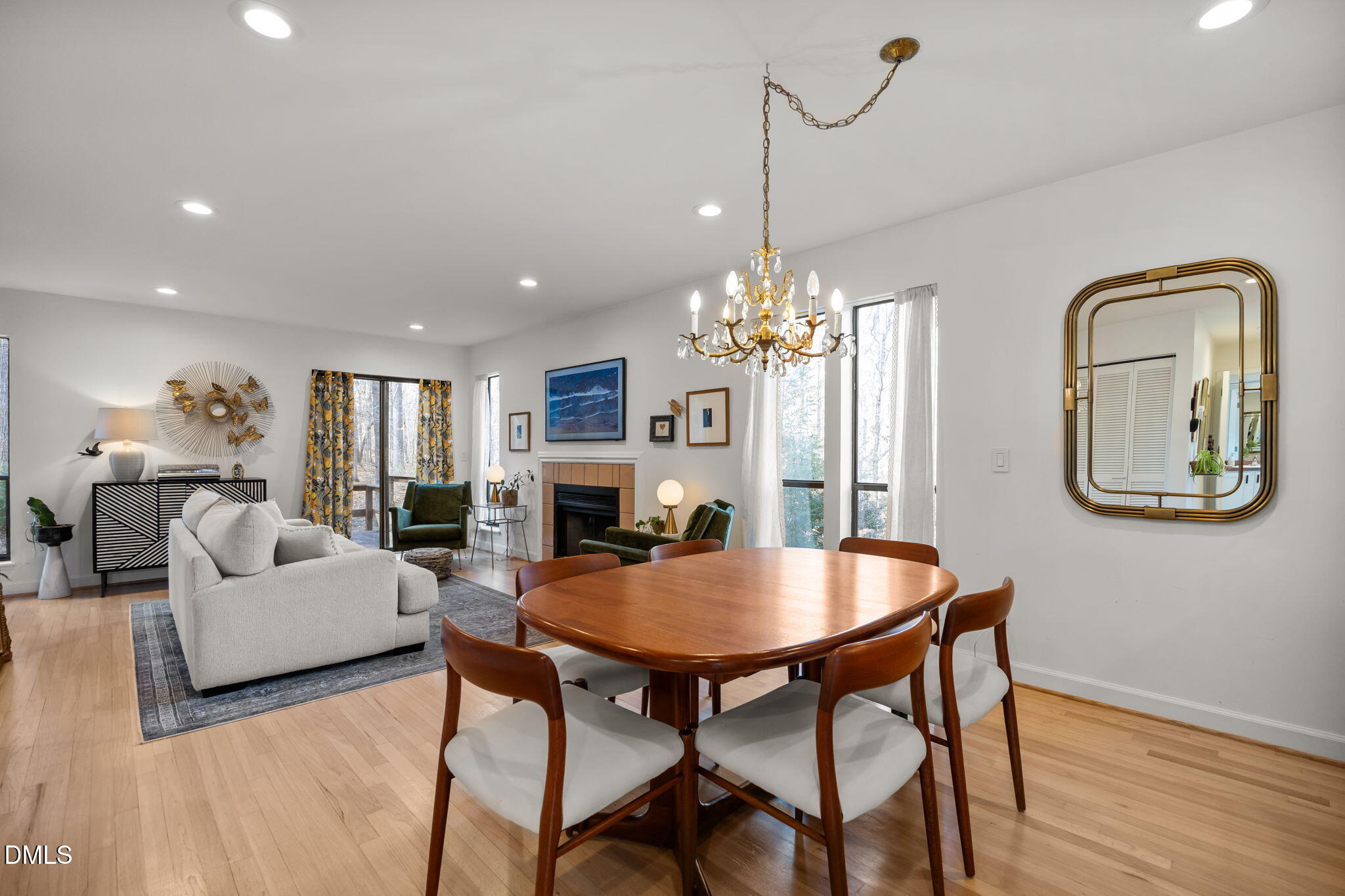 504 Waterside Drive Carrboro, NC 27510 - Photo 21 of 48 a living room with dining table and a chandelier