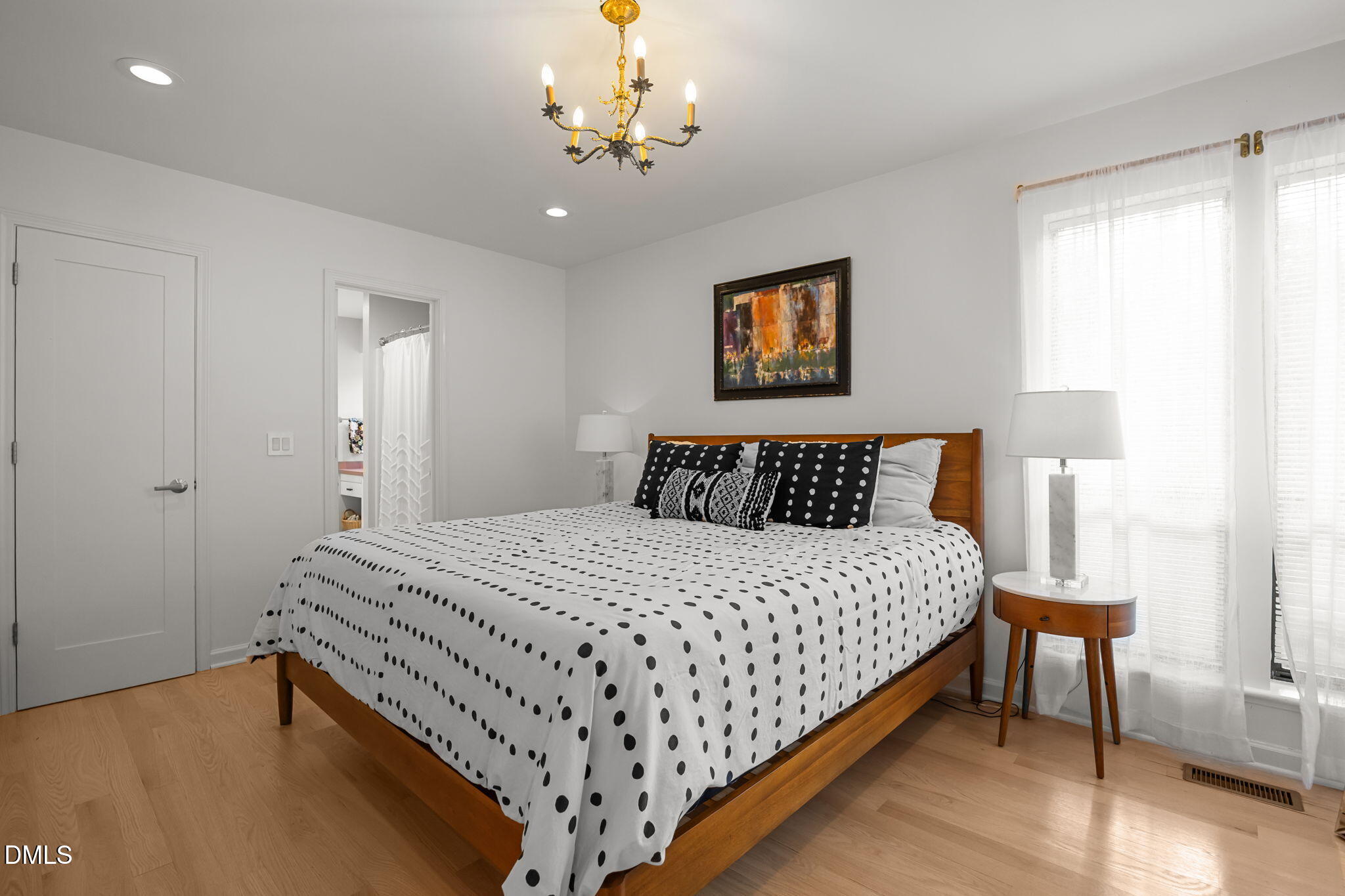 504 Waterside Drive Carrboro, NC 27510 - Photo 30 of 48 a bedroom with bed and a night stand