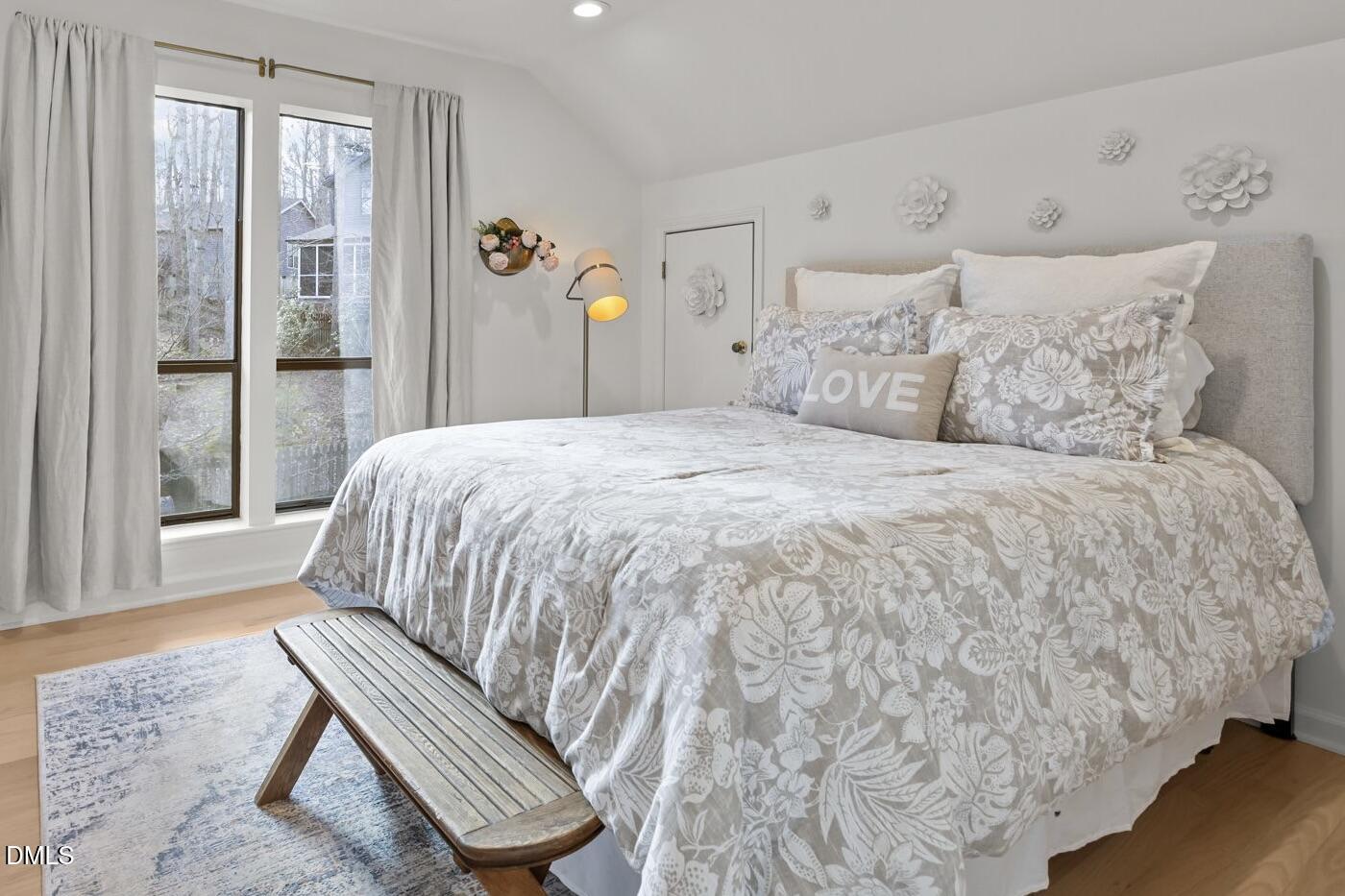 504 Waterside Drive Carrboro, NC 27510 - Photo 34 of 48 a large bed sitting in a bedroom next to a window