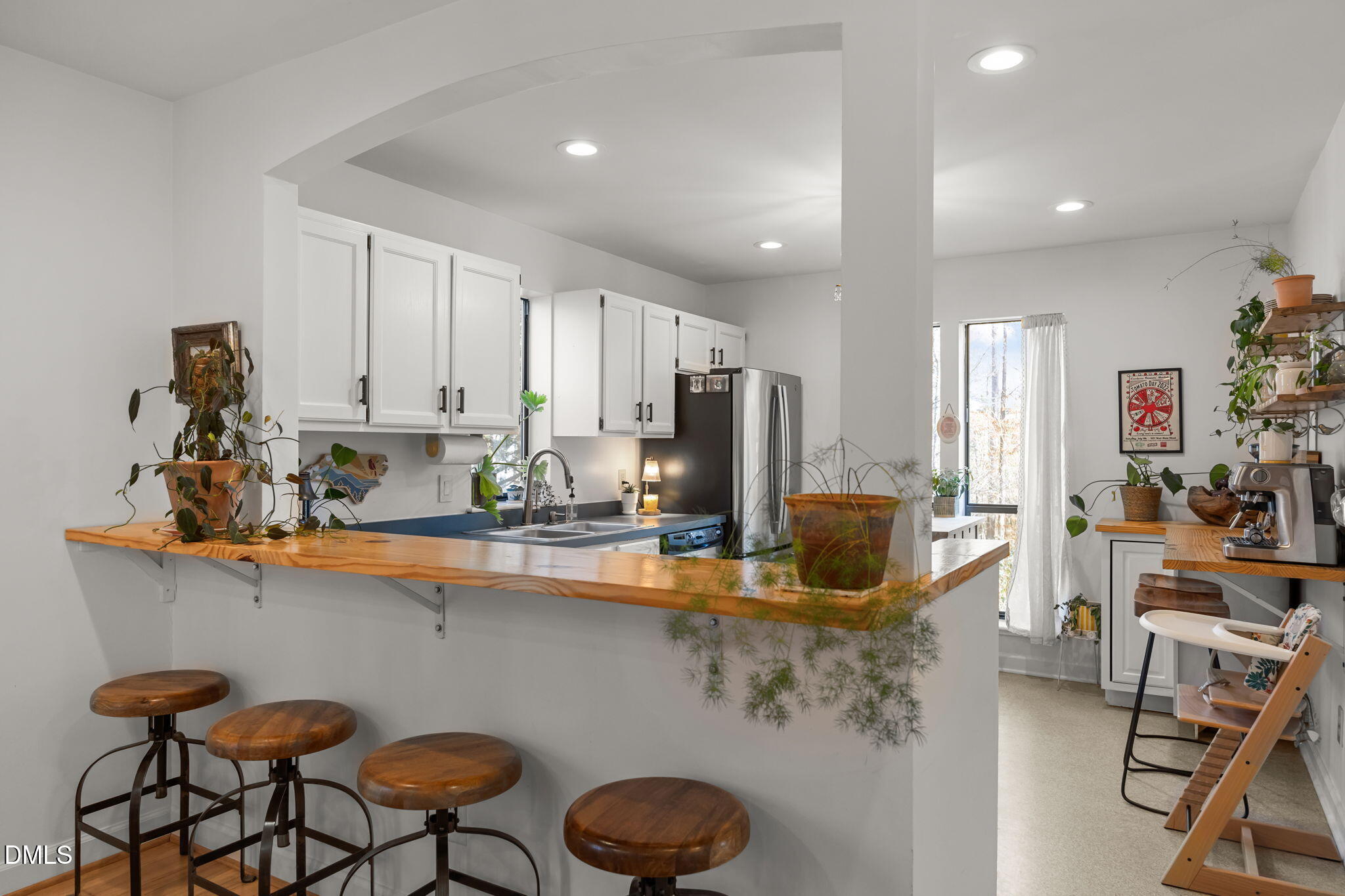 504 Waterside Drive Carrboro, NC 27510 - Photo 4 of 48 a kitchen with stainless steel appliances granite countertop a sink and cabinets