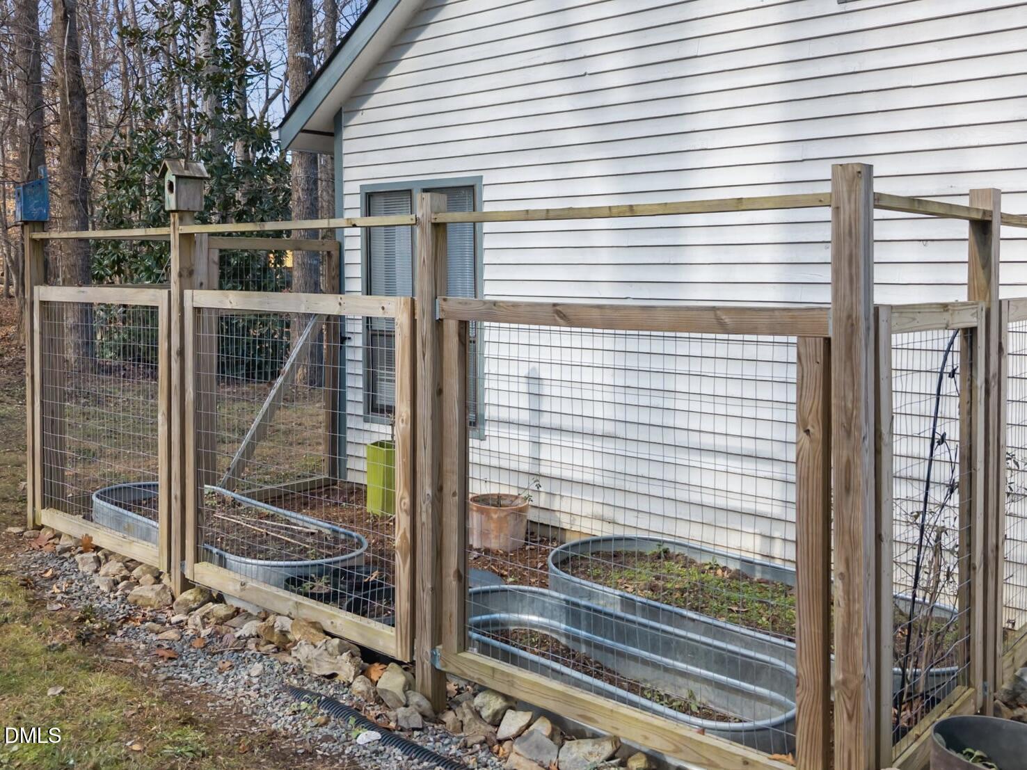 504 Waterside Drive Carrboro, NC 27510 - Photo 41 of 48 a view of a balcony with a floor to ceiling window and wooden fence