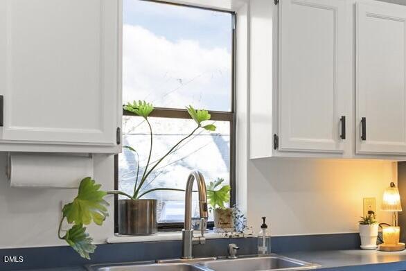 504 Waterside Drive Carrboro, NC 27510 - Photo 10 of 48 a kitchen with a sink and a window
