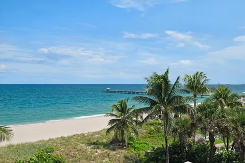 a view of a lake with a yard
