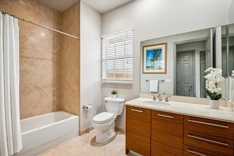 a bathroom with a sink and a large mirror