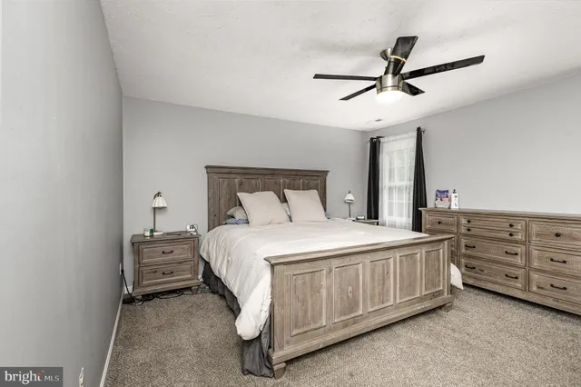 a bedroom with a bed and cabinets