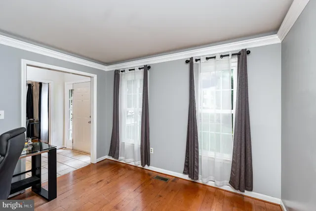 a view of entryway with wooden floor