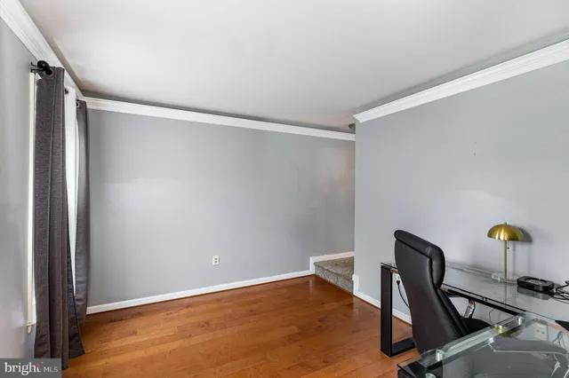 a view of workspace with chair and wooden floor