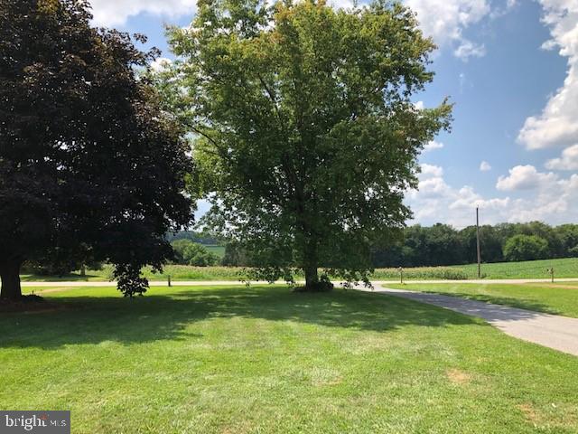2518 Neudecker Road Westminster, MD 21157 - Photo 22 of 22 a view of a playground with lots of green space and trees