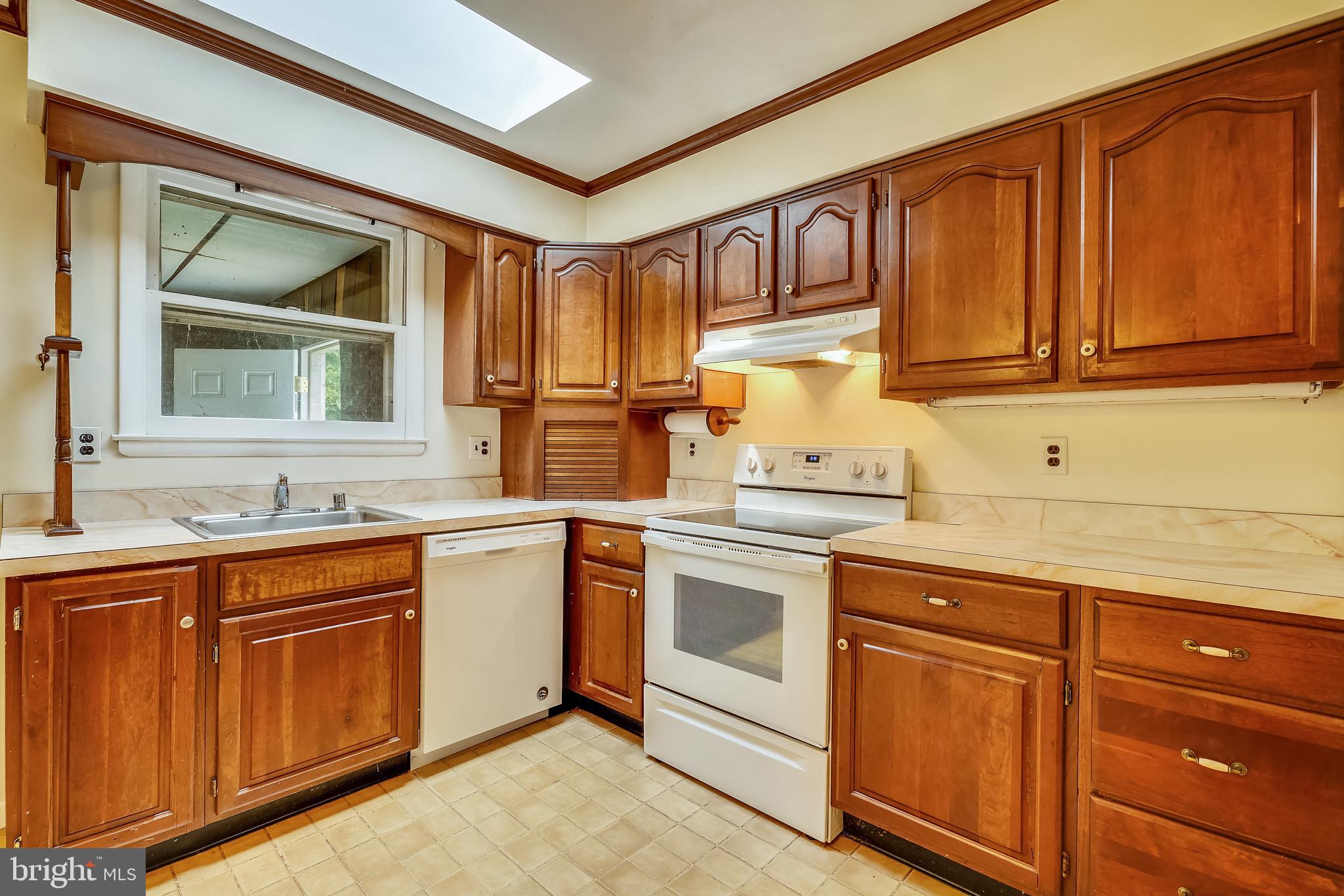 2518 Neudecker Road Westminster, MD 21157 - Photo 4 of 22 a kitchen with granite countertop cabinets stainless steel appliances a sink and a window