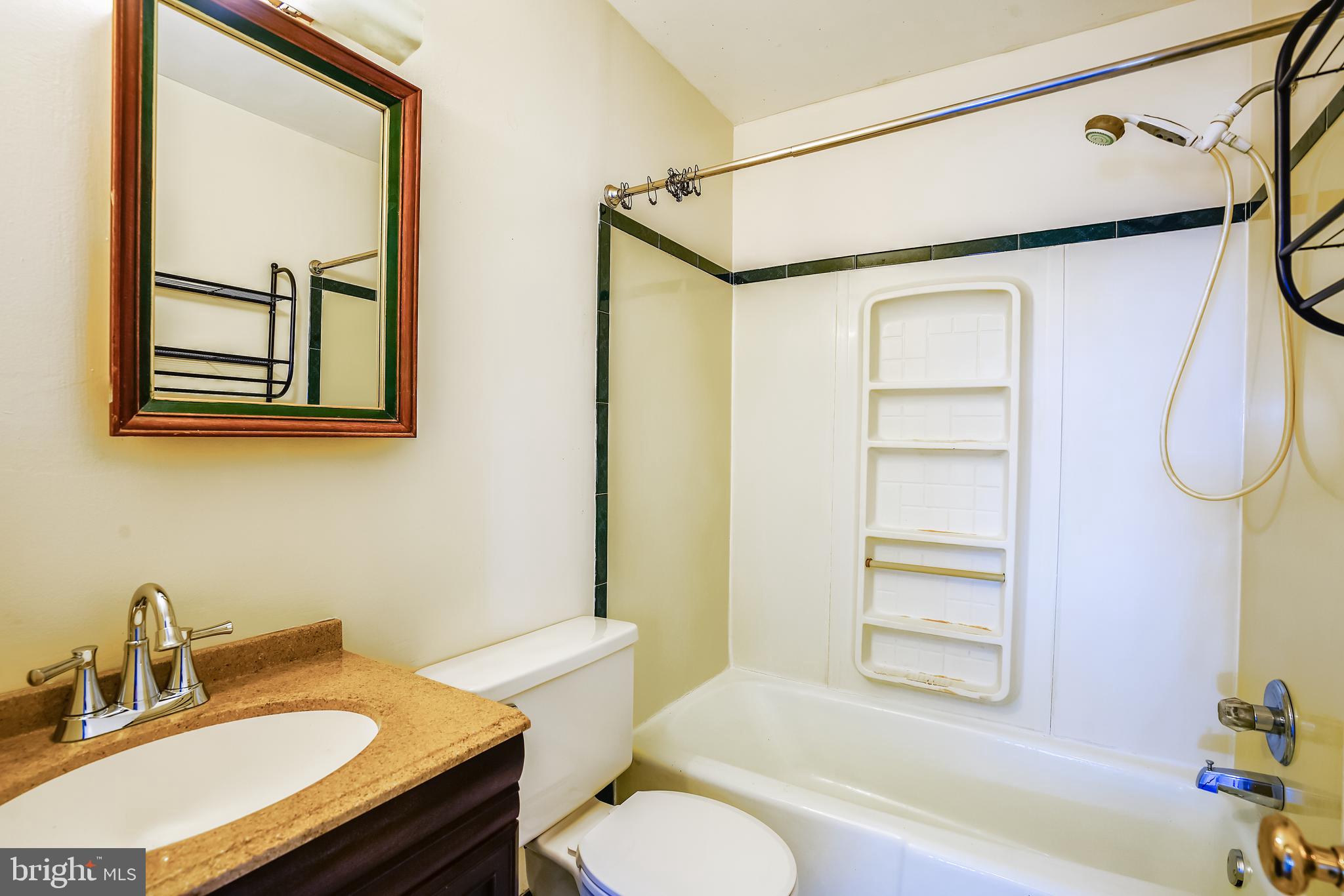 2518 Neudecker Road Westminster, MD 21157 - Photo 6 of 22 a bathroom with a granite countertop sink toilet and shower