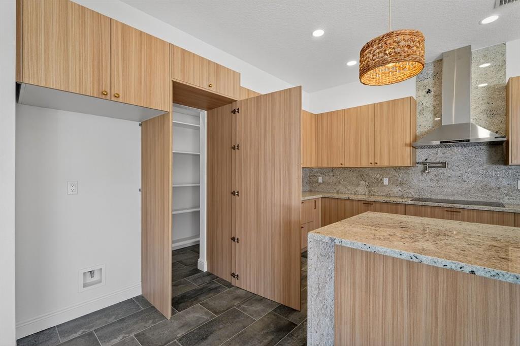7 Crandon Court Palm Coast, FL 32137 - Photo 17 of 72 a kitchen with a refrigerator and a sink
