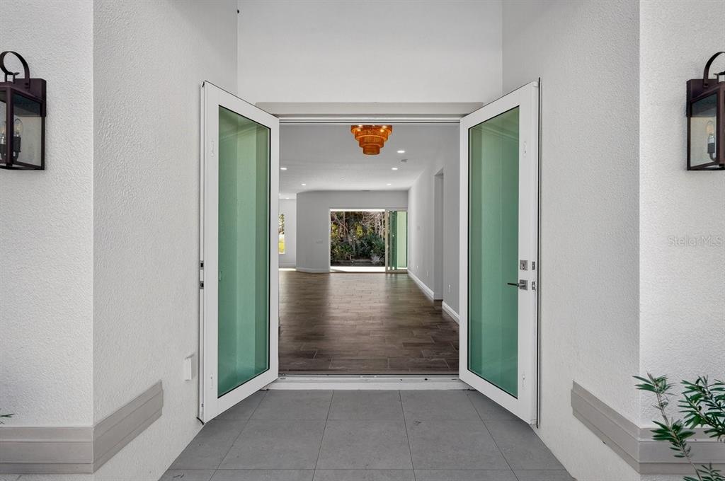 7 Crandon Court Palm Coast, FL 32137 - Photo 2 of 72 a view of a hallway view with wooden floor and a livingroom