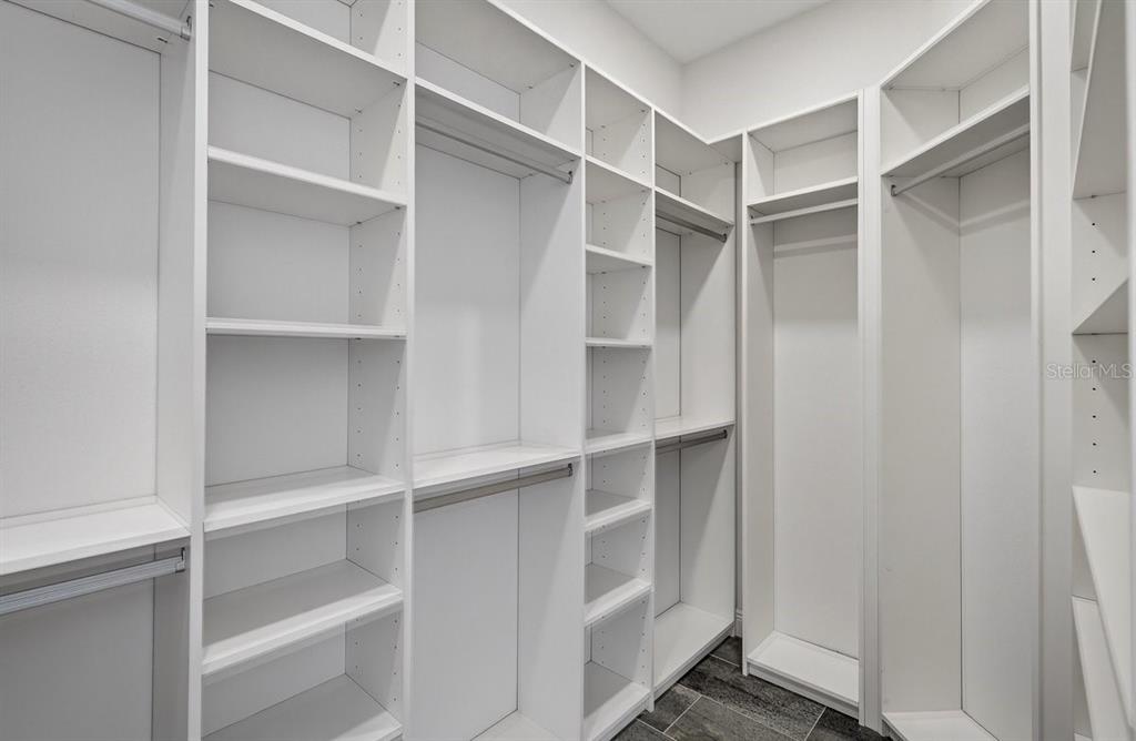 7 Crandon Court Palm Coast, FL 32137 - Photo 32 of 72 a view of walk in closet with empty racks