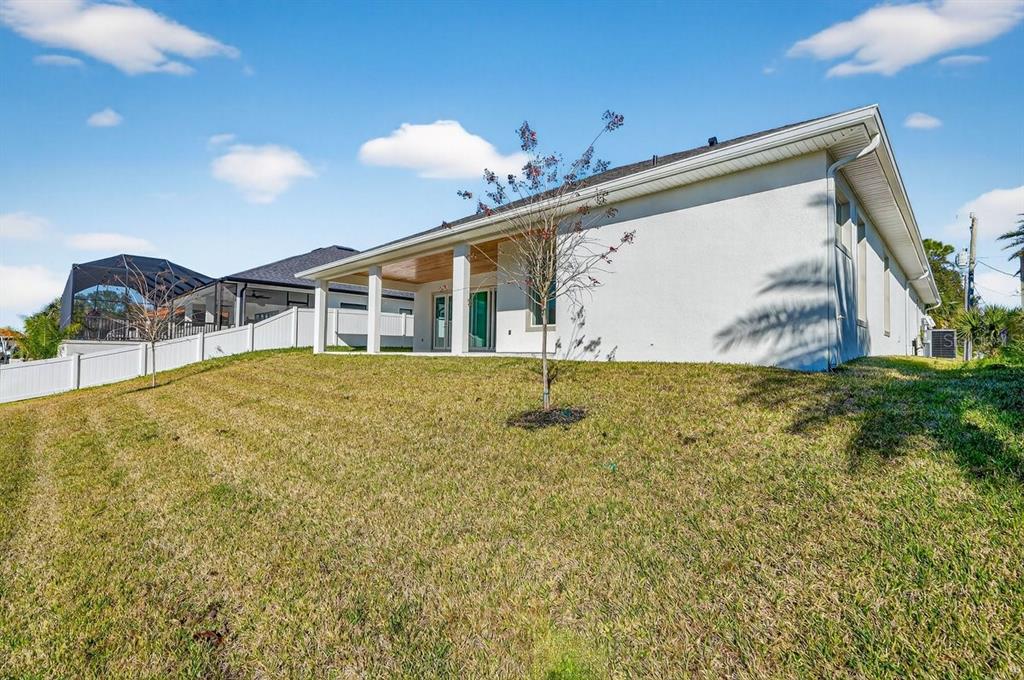 7 Crandon Court Palm Coast, FL 32137 - Photo 58 of 72 a view of a house with a yard