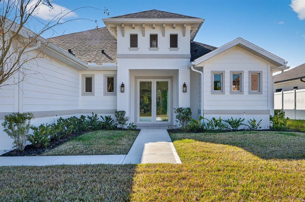 7 Crandon Court Palm Coast, FL 32137 - Photo 67 of 72 a front view of a house with garden