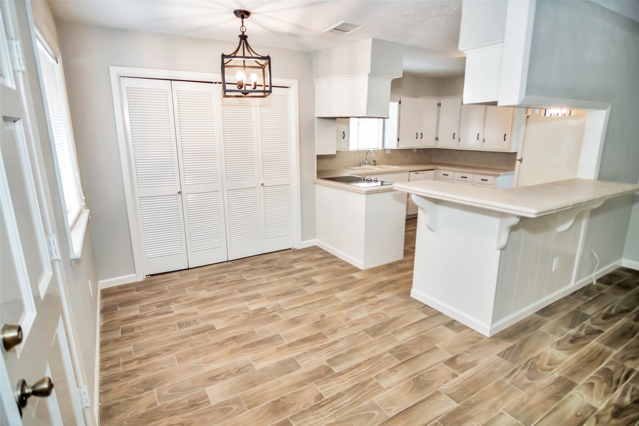 1715 Capstan Road Houston, TX 77062 - Photo 14 of 40 a kitchen with kitchen island a sink appliances and cabinets