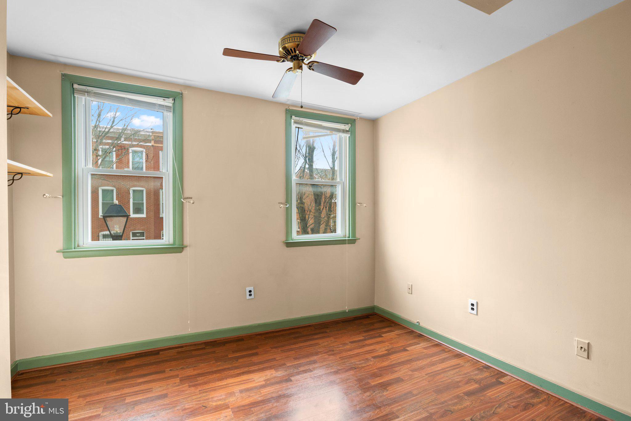 106 Scott Street Baltimore, MD 21201 - Photo 15 of 40 a view of an empty room with windows