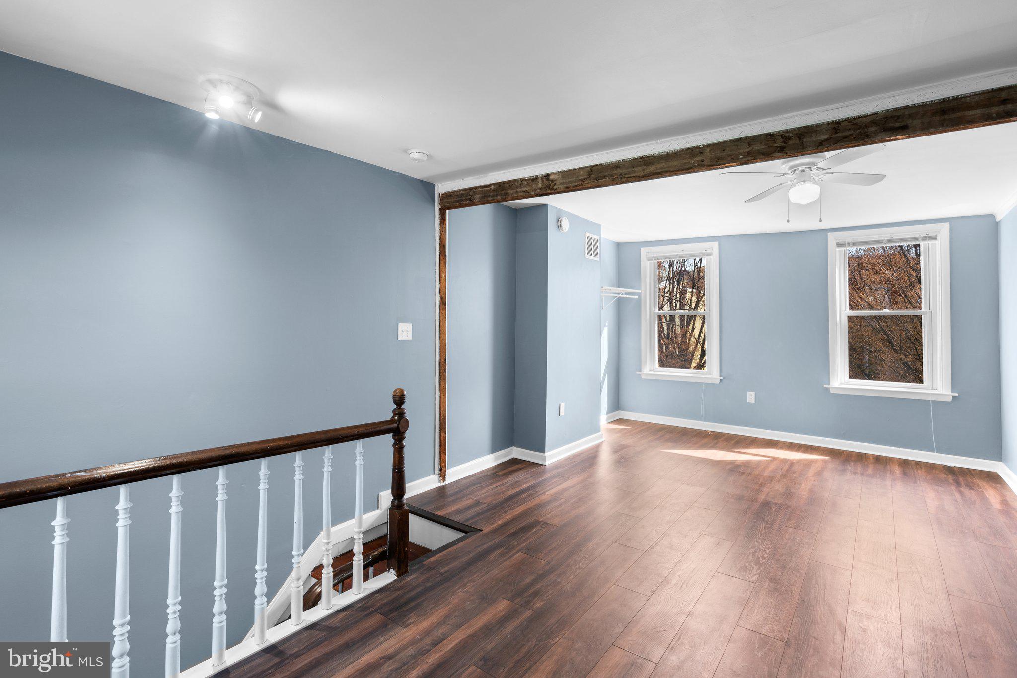 106 Scott Street Baltimore, MD 21201 - Photo 25 of 40 a view of an empty room with wooden floor and a window