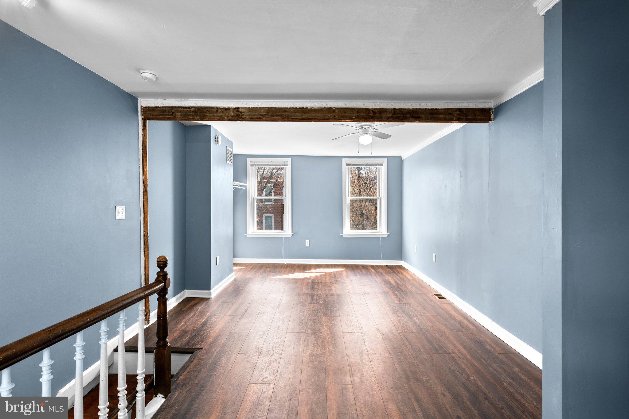 106 Scott Street Baltimore, MD 21201 - Photo 26 of 40 wooden floor in an empty room with a window