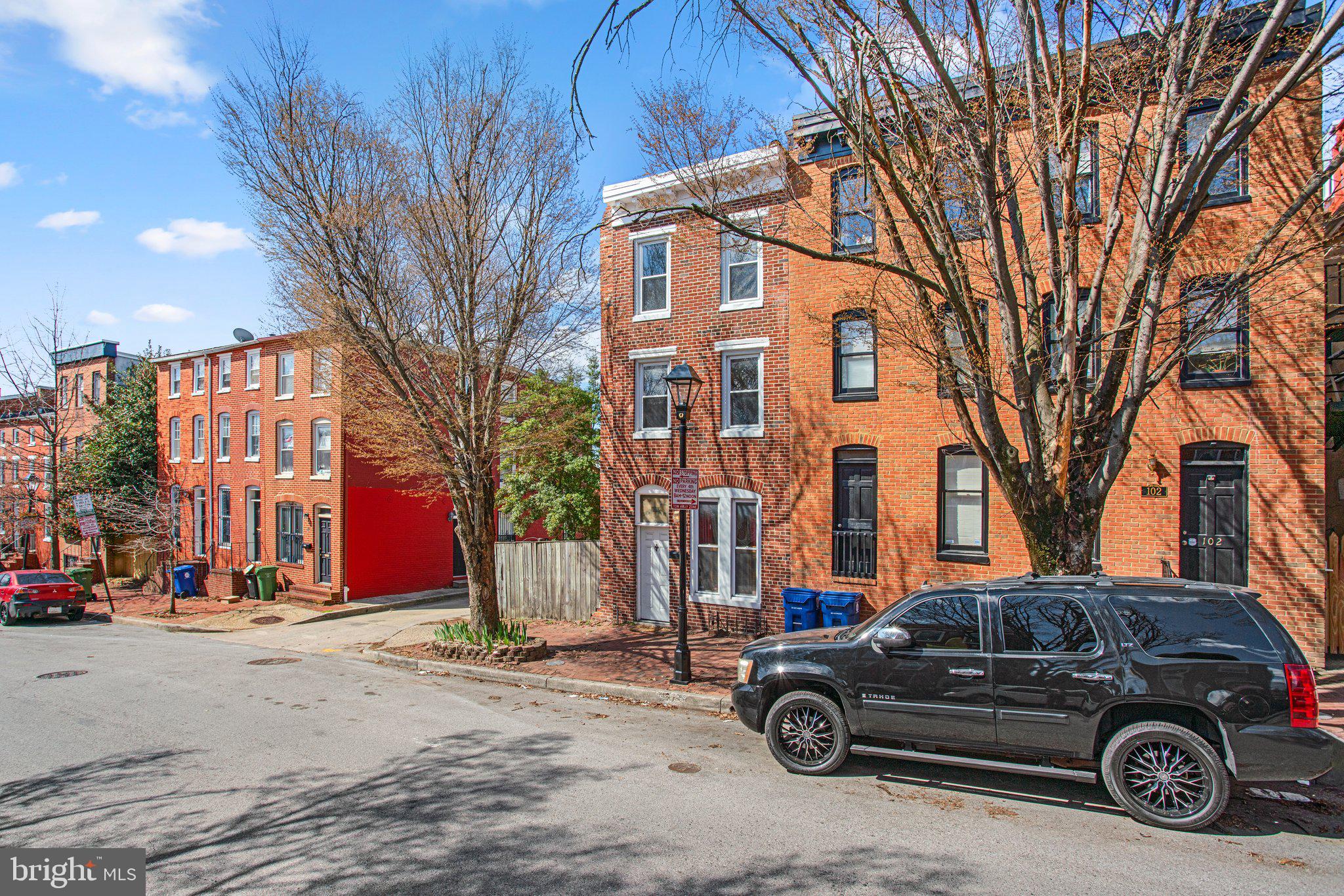 106 Scott Street Baltimore, MD 21201 - Photo 3 of 40 a car parked in front of a building