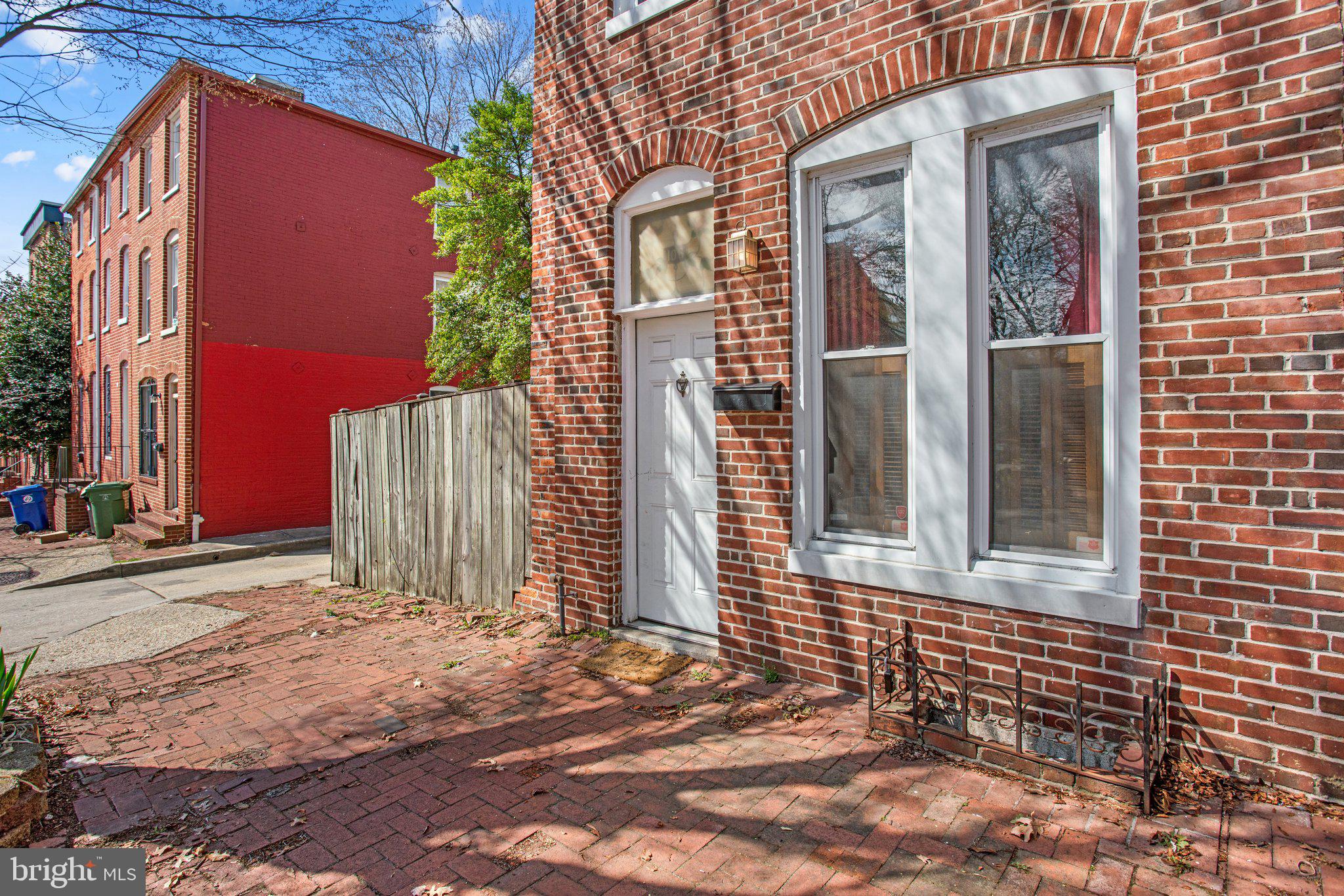 106 Scott Street Baltimore, MD 21201 - Photo 4 of 40 a front view of a house with a garage