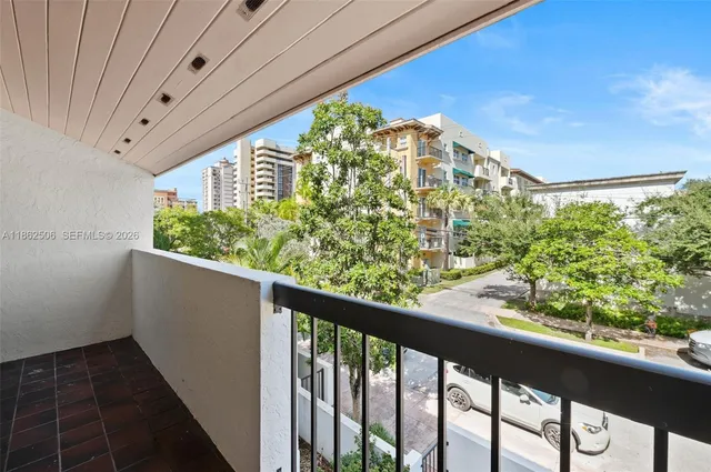 a view of a balcony with plants