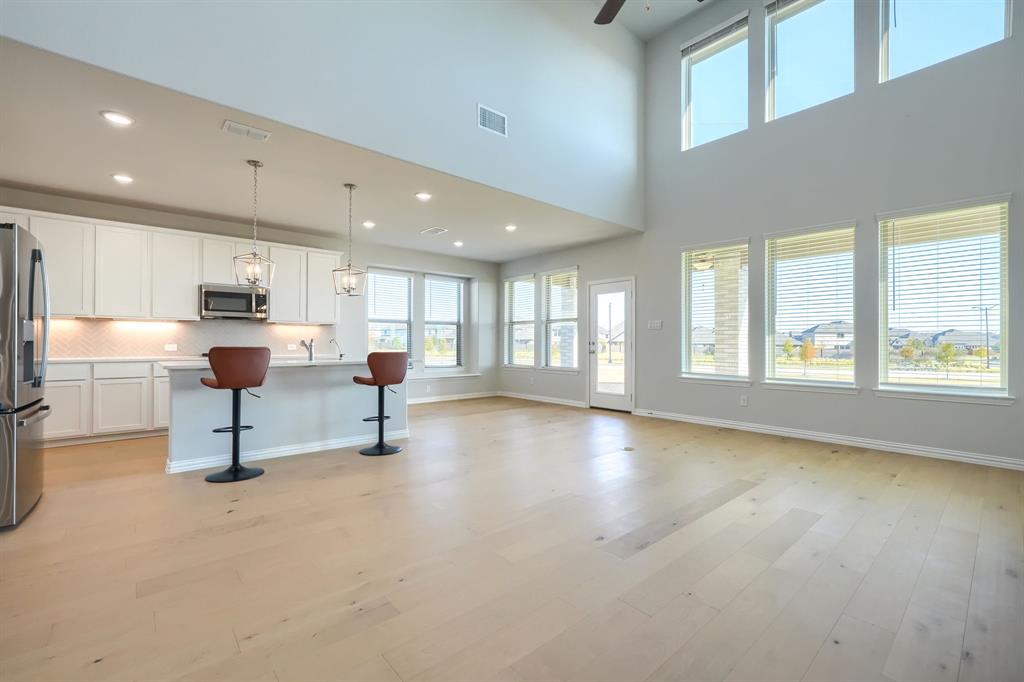 1309 Buttercup Road Prosper, TX 75078 - Photo 11 of 36 a living room with furniture and a large window