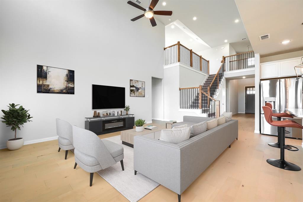 1309 Buttercup Road Prosper, TX 75078 - Photo 13 of 36 a living room with furniture and a flat screen tv