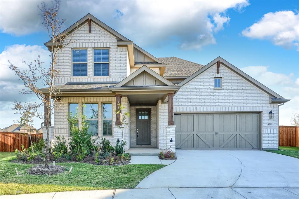 1309 Buttercup Road Prosper, TX 75078 - Photo 2 of 36 a front view of a house with garden