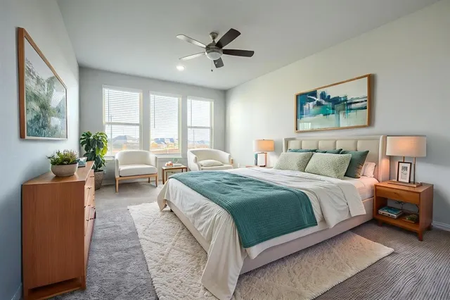 a spacious bedroom with a bed and a couch